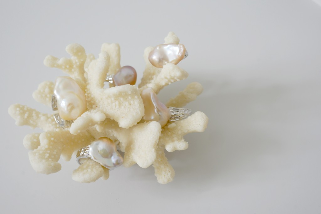 Freshwater pearl rings displayed on a white coral branch — Ollie Pearls Bergen