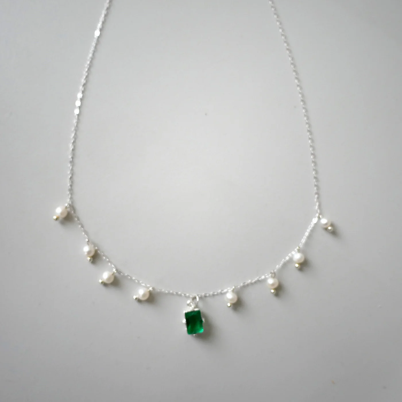 Emerald Pearl Dance — Freshwater Pearl, Green Zircon, Sterling Silver 925 — handmade freshwater pearl necklace by Ollie Pearls Bergen, Norway